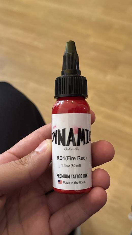 The label of a Dynamic Fire Red ink bottle